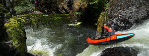 A packrafter paddling over Split Falls on the Salmon River Gorge.