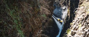 Whitewater Kayaker paddling a waterfall in Chile in his Immersion Research Dry Suit.