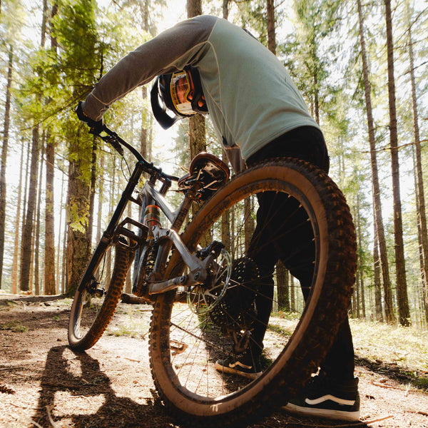 Person on a mountain bike in a forest setting