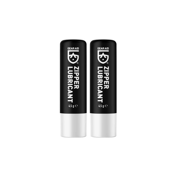 Two black and white tubes of Gear Aid Zipper Lubricant on a white background