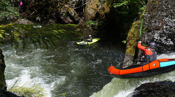 A packrafter paddling over Split Falls on the Salmon River Gorge.