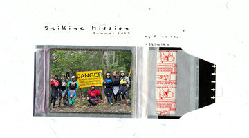Group of kayakers standing infront of warning sign at the stikine river.