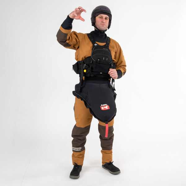 Person wearing a Devil's Club Dry Suit with kayaking gear on