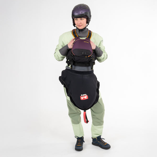 Person wearing Immersion Research Pistachio Dry Suit with kayaking gear