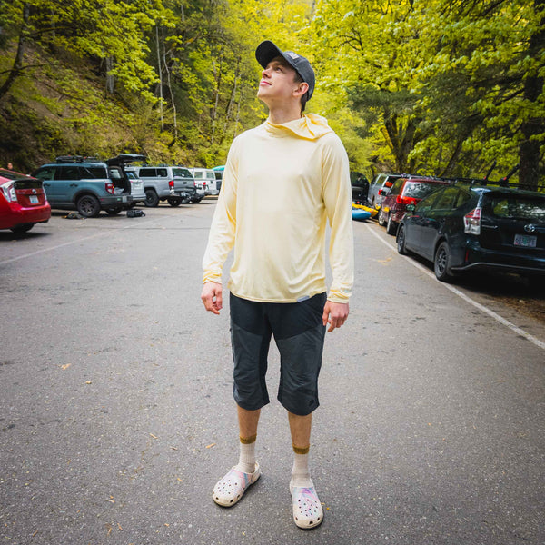 Person in road with yellow sun shirt