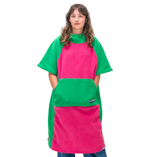 Person wearing a pink and green apron on a white background