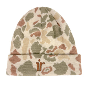 A knit beanie hat featuring a multi-toned camouflage pattern in beige, olive green, and terracotta brown, with a small brown embroidered logo on the folded cuff.