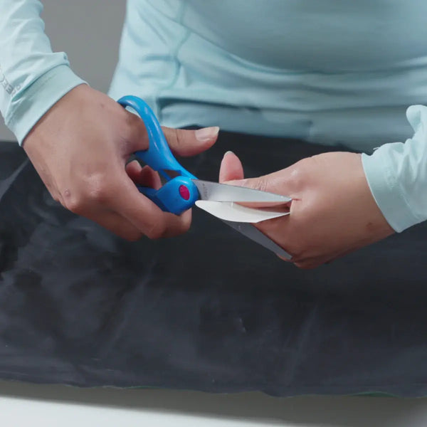 Gear Aid Tenacious Tape Flex Patches being cut to size before use