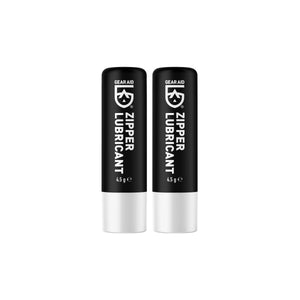 Two black and white tubes of Gear Aid Zipper Lubricant on a white background