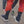 Kayaker putting neoprene socks on over dry suit booties