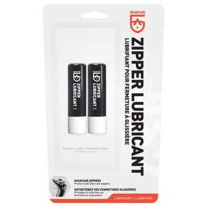 Two black zipper lubricant sticks in a Gear Aid packaging on a white background