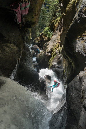Female canyoneering in Aphrodite dry suit.