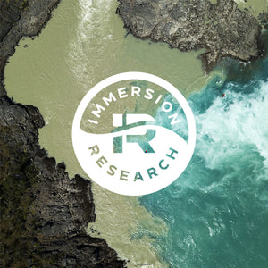 Immersion Research Circular Badge Logo laid over a photo of a confluence of 2 rivers with kayakers in the background